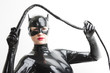 © Richard Semik - portrait of standing woman wearing latex clothes with a whip