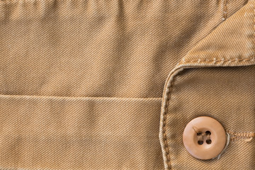 front pocket on brown shirt textile texture background