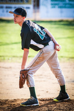 Young Boy (10-11) Standing On Pitchers Mound