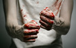 murderer shows bloody hands and experiencing depression and pain
