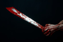 Bloody Hands Holding A Bloody Machete Isolated In Studio