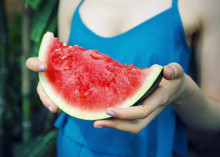 Woman Holding Slice Of Watermelon