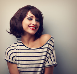 Wall Mural - Happy laughing young woman with short hair in fashion blouse. Vi