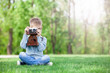 © Masson - young boy with a vintage camera