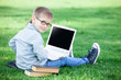 © Masson - boy with a books and laptop computer