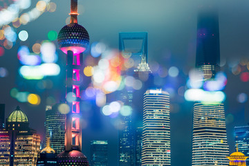 Poster - Blurred city lights and office buildings