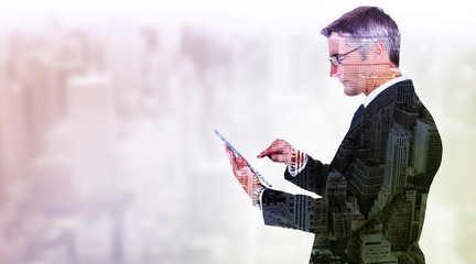 Poster - Composite image of mid section of a businessman touching tablet