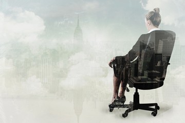 Poster - Businesswoman sitting on chair in black suit