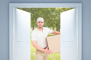 Aufkleber - Composite image of delivery man with cardboard box