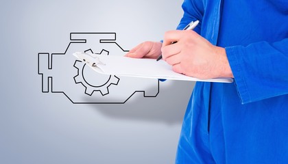 Poster - Composite image of male mechanic writing on clipboard