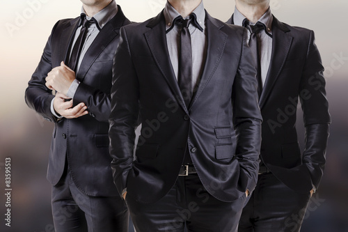 Fotografie, Obraz Close up image of three business men in black suit