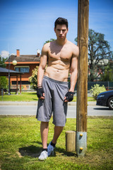 Wall Mural - Shirtless young man resting after workout outdoor