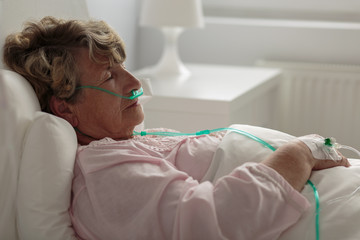sick woman with nasal cannula