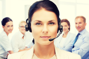 Wall Mural - helpline operator with headphones in call centre