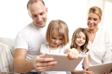 Poster - happy family with tablet pc computers at home