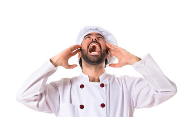 Wall Mural - frustrated chef over white background