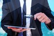 © WavebreakMediaMicro - Businessman looking at his tablet through magnifying glass