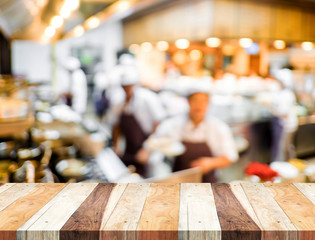 Canvas Print - Empty wood table and blurred restaurant light background. produc