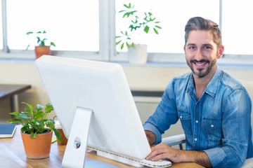 Sticker - Casual businessman working at his desk