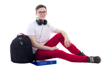 Poster - handsome teenage boy with backpack and headphones sitting isolat