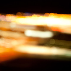 Wall Mural - golden bright lights on dark night background