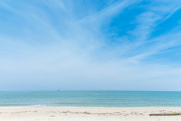 Calm beach in sunny blue sky day