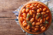beans in tomato sauce with dill horizontal top view
