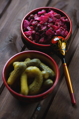 Traditional russian salad vinaigrette and pickles, studio shot