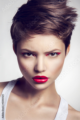 Naklejka dekoracyjna Portrait of beautiful girl with red lips.