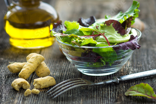 Fotografie, Obraz Summer salad in a cup on a wooden background