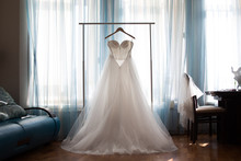 The Perfect Wedding Dress With A Full Skirt On A Hanger 