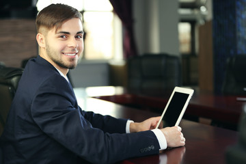 Sticker - Businessman working with tablet in office