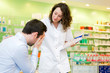 © Production Perig - Attractive pharmacist comfort a customer suffering