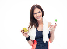 Fitness Woman Holding Apple And Bottle With Water