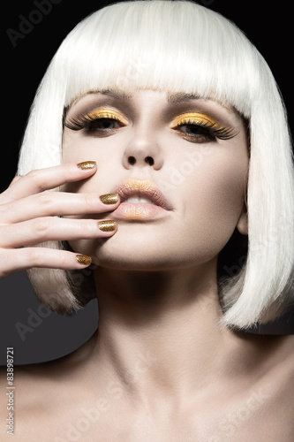 Naklejka na meble Beautiful girl in a white wig, with gold makeup and nails