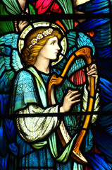 Canvas Print - Angel making music on a harp (stained glass)