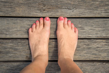 Selfie Of Woman Bare Feet On Wooden Floor