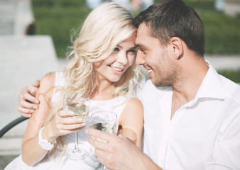 Poster - couple drinking wine in cafe