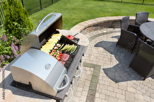Fotografie, Obraz Grilling food on an outdoor gas barbecue