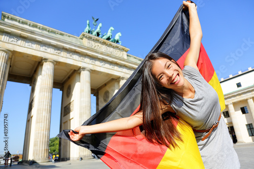 Fotomural German flag woman happy at Berlin Germany