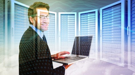 Poster - Composite image of smiling businessman using a laptop 