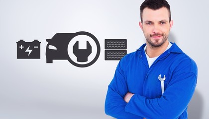 Poster - Composite image of happy mechanic holding spanner 