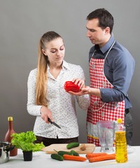 Young couple cooking together