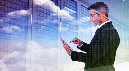 Poster - Composite image of mid section of a businessman touching tablet