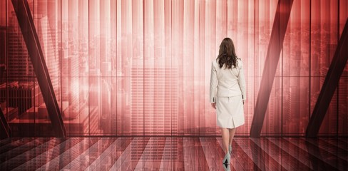 Poster - Composite image of businesswoman walking