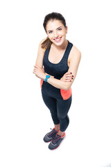 Poster - Happy sporty woman standing with arms folded