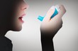 © WavebreakMediaMicro - Composite image of close up of a woman using an asthma inhaler