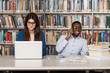 © Jale Ibrak - Young Students Using Their Laptop In A Library