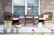 Wicker furniture on the patio with a samovar