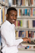 © Jale Ibrak - Happy Male Student With Laptop In Library